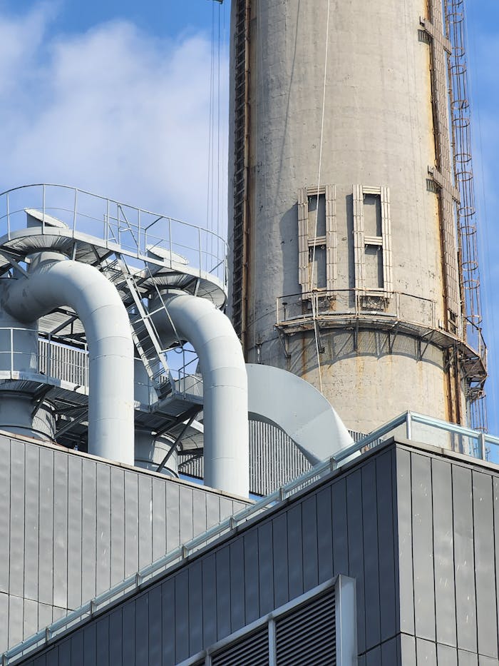 Detailed view of a factory chimney and pipes in Huang Pu Qu, Shanghai, China.