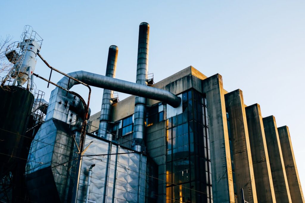 The Art of Drawing Readers In: Your attractive post title goes here Low angle exterior of factory located on city street under blue sky in evening time